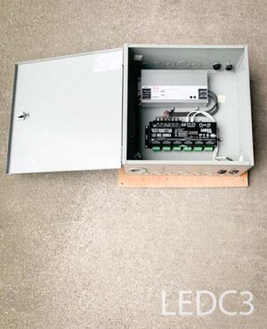 LEDC3-Qty-18. 20 amp 24 volt power supply with 24 circuit 4 amp per channel dimming decoder in hinged metal box.