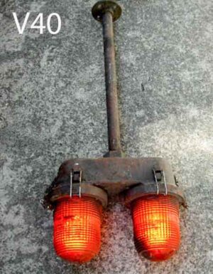 V40-Qty-1.  Metal aged base with two red lights with 2 cords. 27in long top to bottom 12in wide