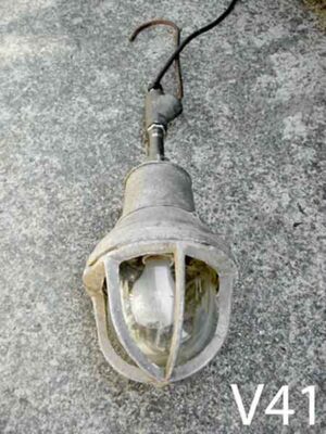 V41-Qty-1. Industrial light with glass, cage, hook and cord.  27" x  7"D