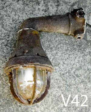 V42-Qty-1. Metal industrial aged wall mount with glass, cage and cord. 12" H