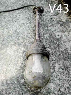 V43-Qty-1. Metal with glass aged industrial light, 22" top to bottom c/w cord