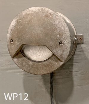 WP12-Qty-3. Metal aged marine light with cord that can come out bottom or back. Can be surface or flush mounted. 120 volt, comes with light bulb. 7"D 6" out