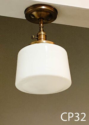 CP32-Qty-2.  Bronze vintage base with switch and white cylinder glass with medium base socket. 12”H x 8”D