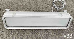 V33-Qty-2. Aluminum light with glass opaque front, swivel base, 24volt hybrid leds and cord. 28" x 7"