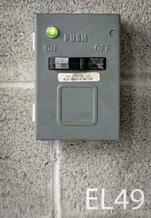 EL49-Qty-1. Grey metal switch with fuses and green 12 volt light. 7" x 5"