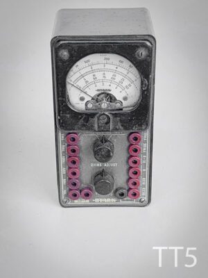 TT5-Qty-1. Black table top ohms meter with gauge, 2 dials, and 14 wire ports. 3"W x 6"H