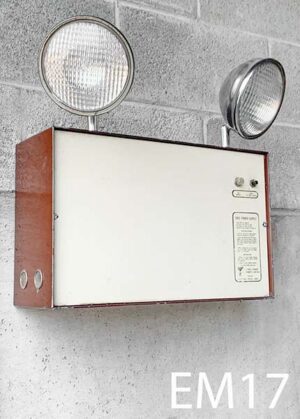 EM17-Qty-2. Metal brown and beige base with two 12 volt emergency lights and 120 volt amber indicator light. 10"H x 16"W