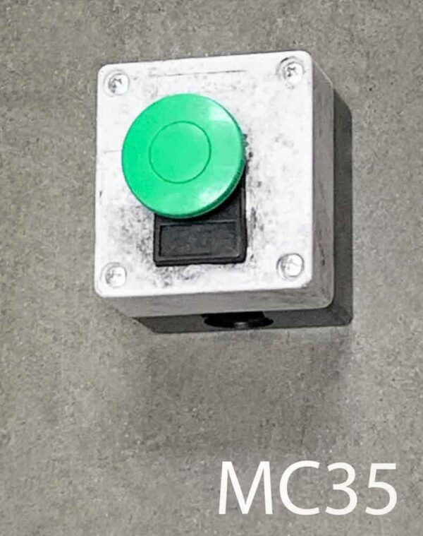 MC35-Qty-4. Grey and black box with green push button. 3" x 3"