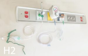 H2-Qty-1. Grey hospital panel with 3 medical outlets, 2 plugs and 3 switches. 38″ W x 6″ H x 3 1/2″ Deep. c/w cord.