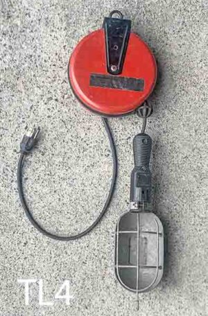 TL4-Qty-1. Black vintage trouble light with retractable 15' cord and burgundy housing.