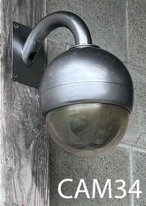 CAM34-Qty-1. Grey security camera with curved bracket and bubble front. 7"D 13"H